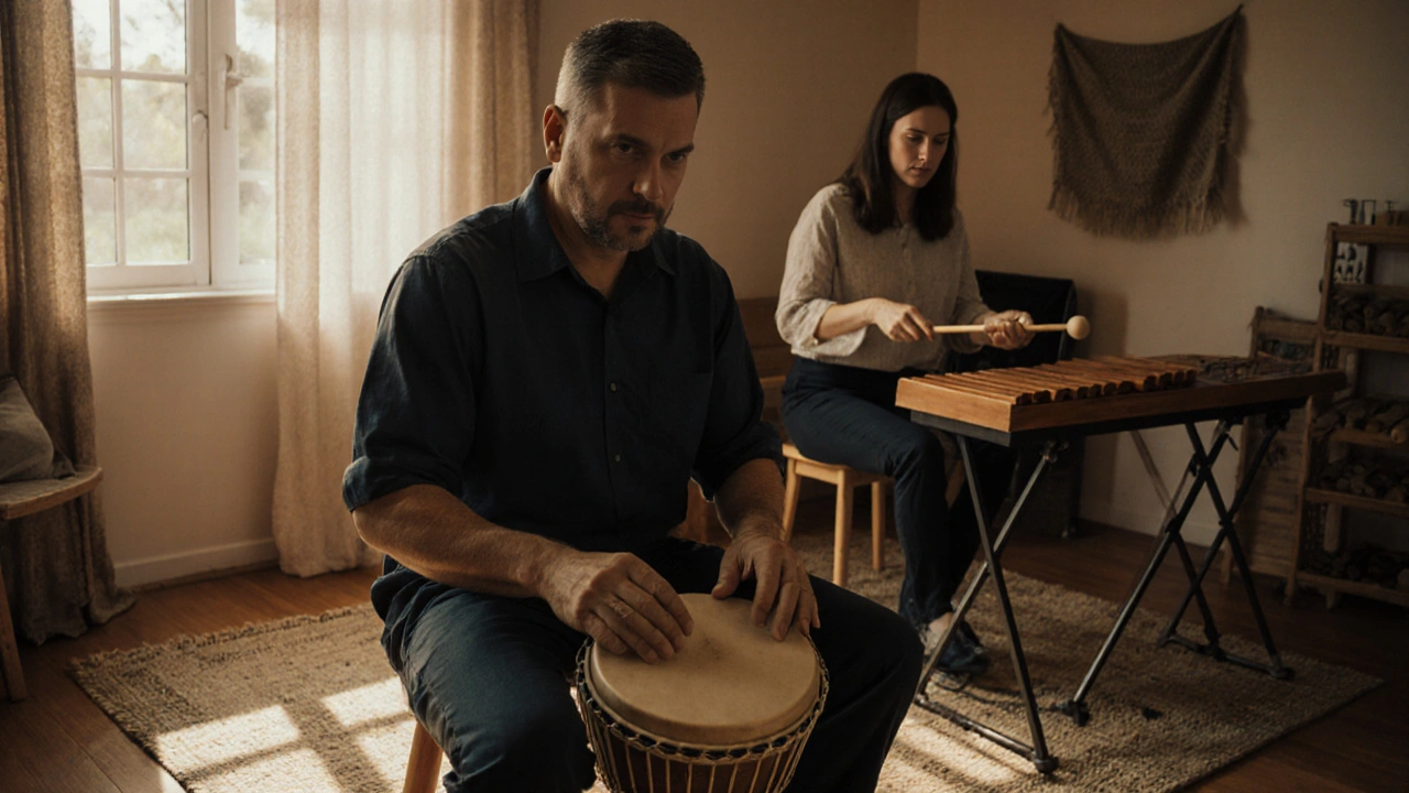 Veteran gently drumming in a quiet studio, therapist mirroring movements with xylophone nearby.